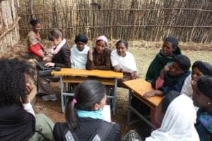 Ryan Newton and Anjali Banthia (Product Development) conduct a focus group in Lumame, Ethiopia for a youth savings program