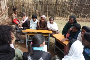 Ryan Newton and Anjali Banthia (Product Development) conduct a focus group in Lumame, Ethiopia for a youth savings program