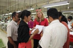 Cathleen Tobin conducting research at a garment factory