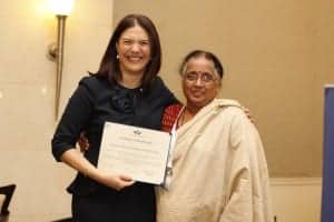 Viji Das with Women's World Banking CEO, Mary Ellen Iskenderian, receiving an updated Certificate of Membership to the Women's World Banking network