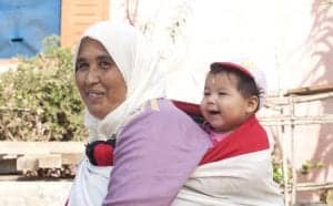 A health microinsurance client from Morocco with her youngest child