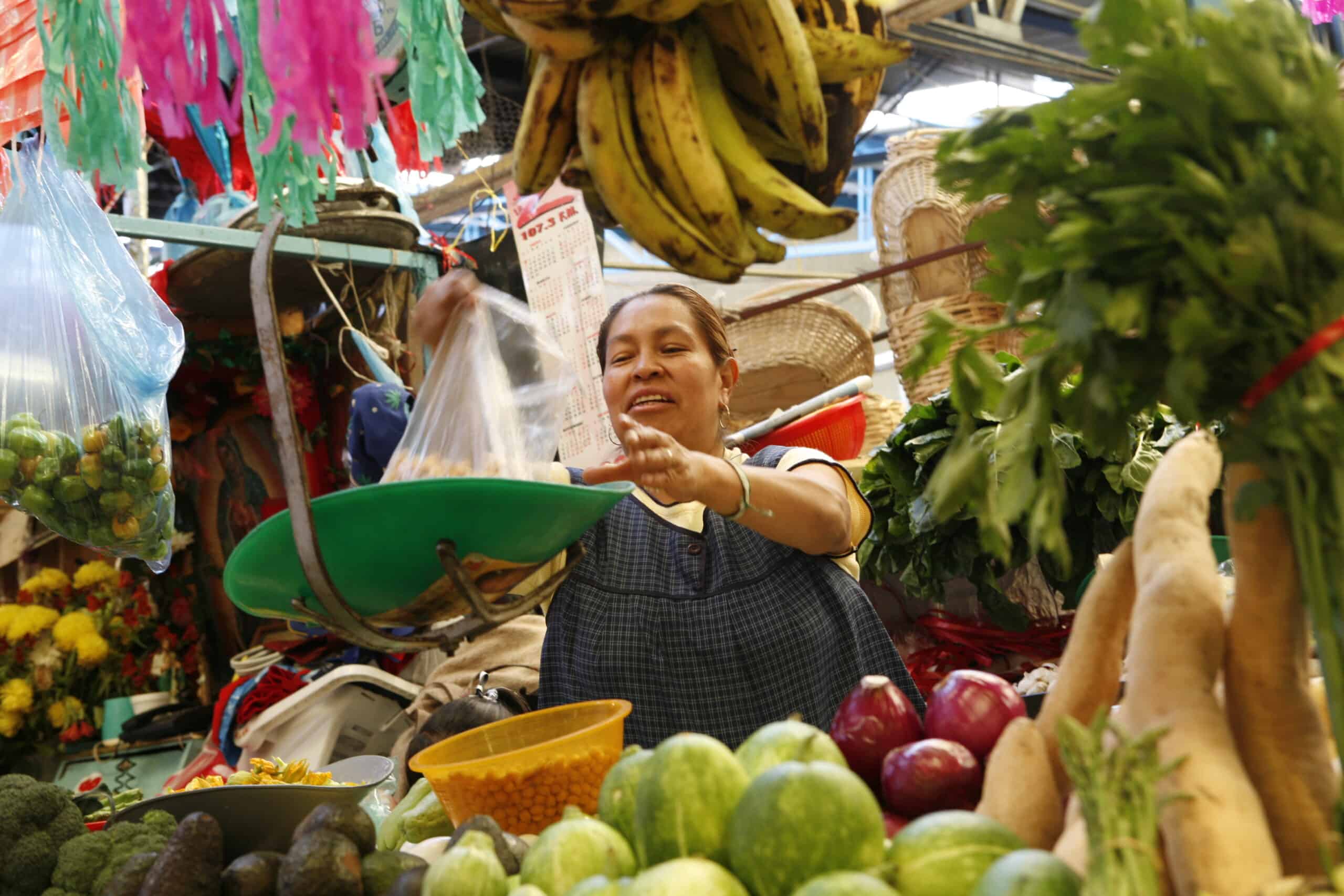 Mexico 2006 Fincomun veggie market seller02 scaled