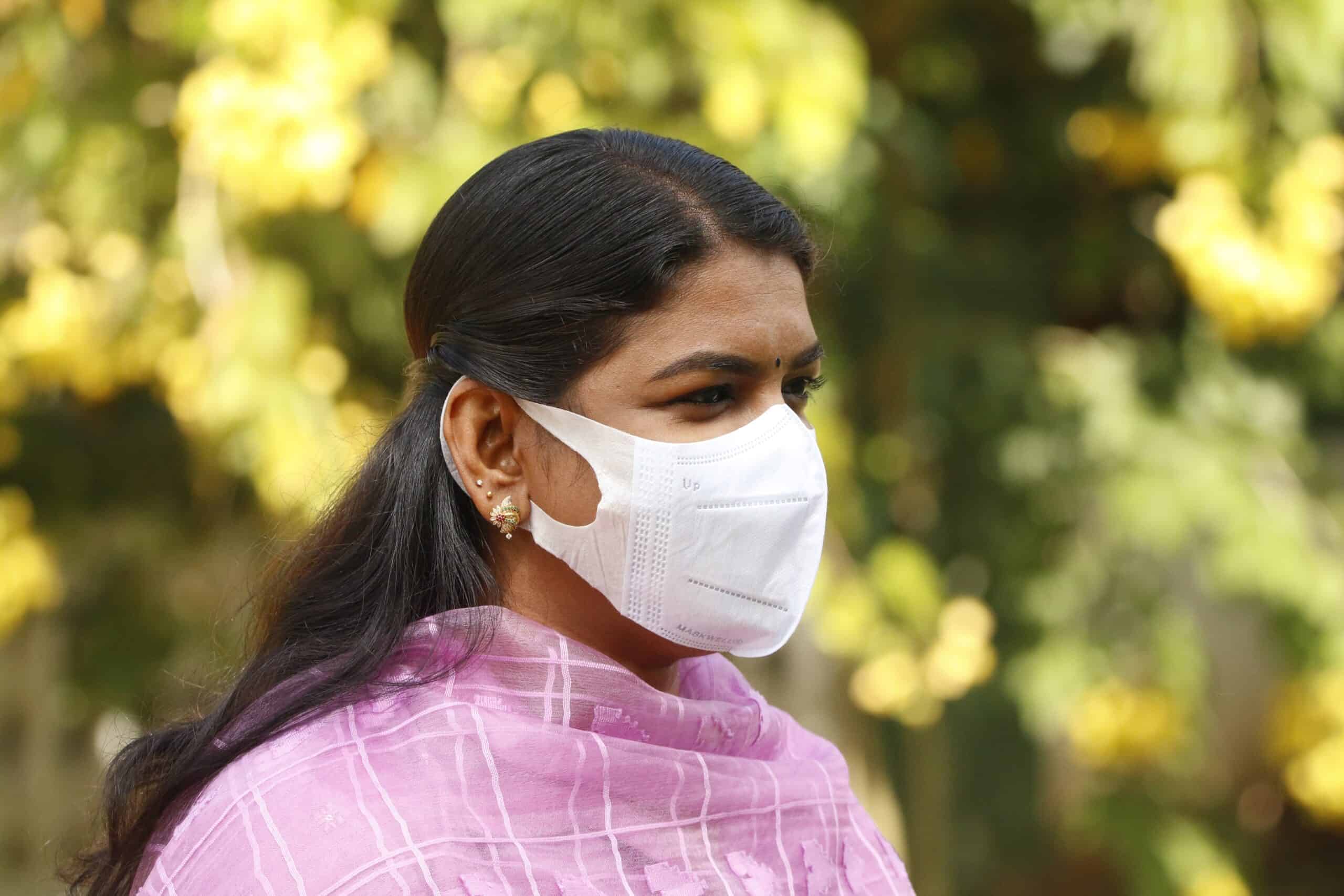 Woman in India wearing mask to protect against COVID-19.