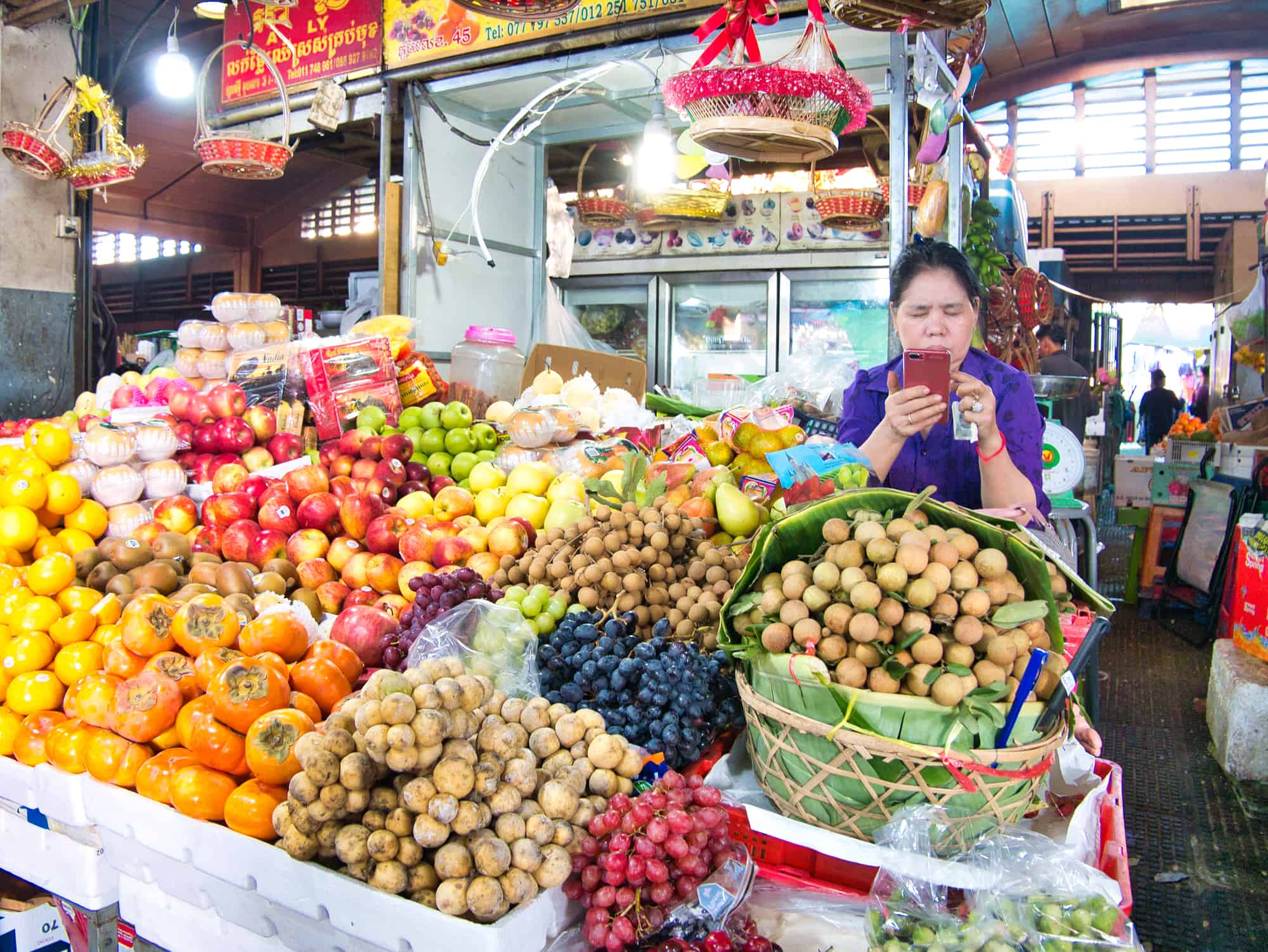 A woman entrepreneur on her smart phone in Cambodia